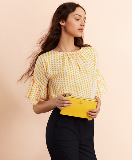 yellow and white polka dot shirt